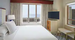 Bed in room with TV